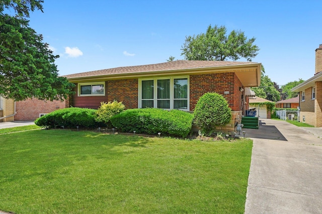 5504 Oakdale Dr, Oak Lawn, IL 60453 - view of front of house with brick siding, a front yard, and a detached garage