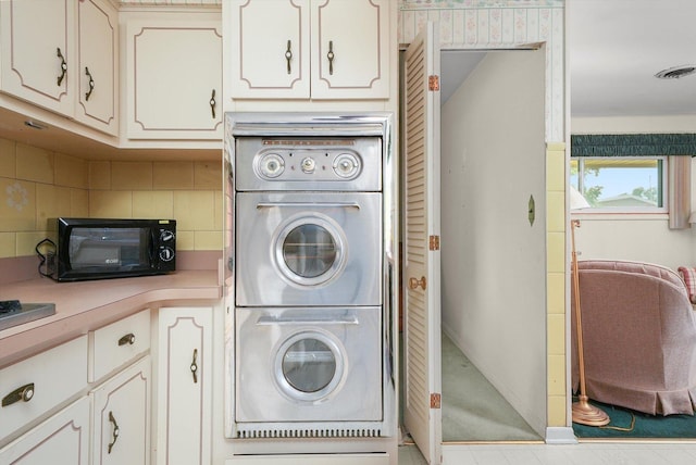 5504 Oakdale Dr, Oak Lawn, IL 60453 - laundry area featuring estacked washer and dryer and baseboards