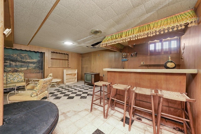 5504 Oakdale Dr, Oak Lawn, IL 60453 - indoor dry bar with tile patterned floors and wood walls