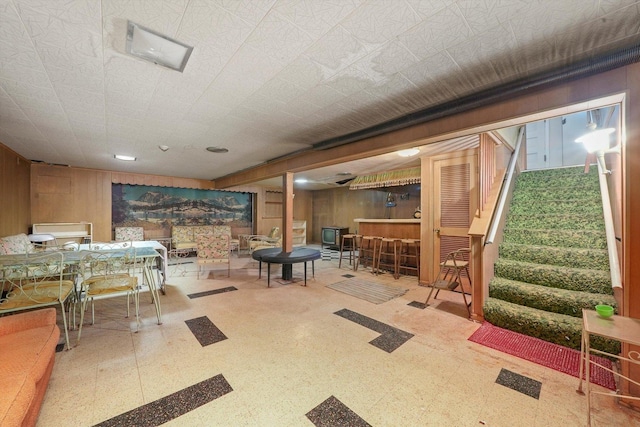 5504 Oakdale Dr, Oak Lawn, IL 60453 - finished basement with tile patterned floors, a dry bar, and wooden walls
