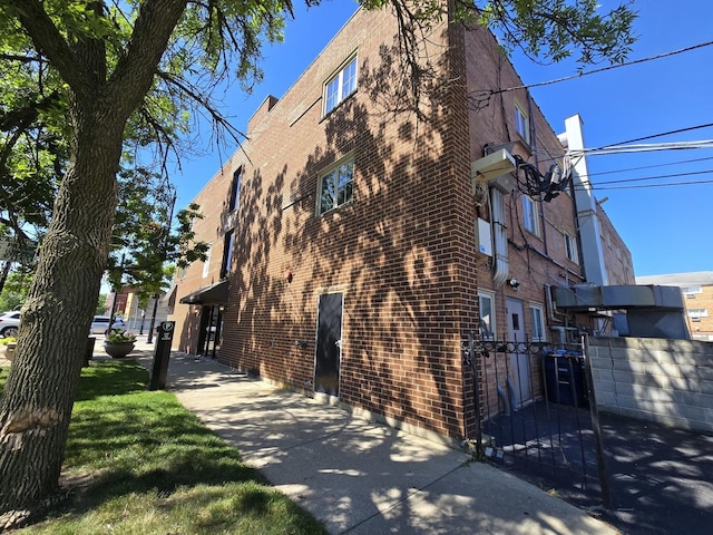 6400 N Sacramento Ave Unit 205, Chicago, IL 60645 - view of home's exterior with brick siding