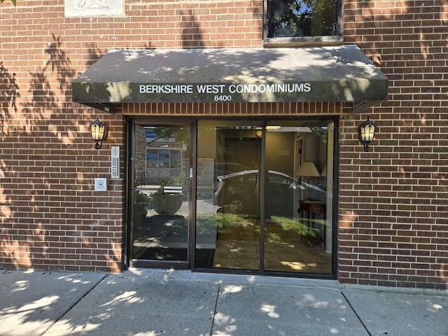 6400 N Sacramento Ave Unit 205, Chicago, IL 60645 - view of exterior entry with brick siding
