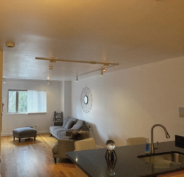 6400 N Sacramento Ave Unit 205, Chicago, IL 60645 - living area featuring wood finished floors and rail lighting