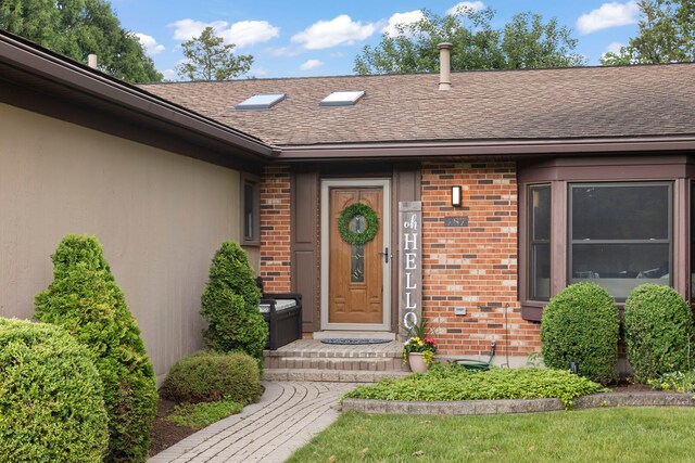 787 Bluejay Cir, Elk Grove Village, IL 60007 - property entrance featuring brick siding and a shingled roof