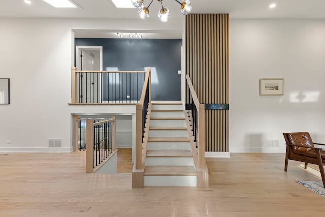 787 Bluejay Cir, Elk Grove Village, IL 60007 - stairs featuring wood finished floors, recessed lighting, and a chandelier