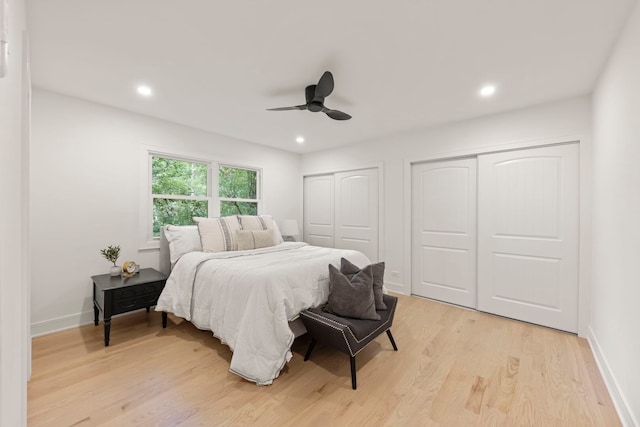787 Bluejay Cir, Elk Grove Village, IL 60007 - bedroom with multiple closets, light wood-style flooring, recessed lighting, and a ceiling fan