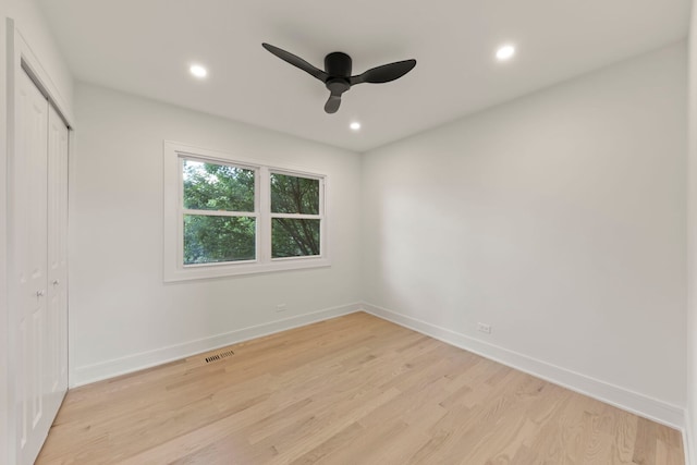 787 Bluejay Cir, Elk Grove Village, IL 60007 - unfurnished bedroom with light wood finished floors, recessed lighting, a closet, and ceiling fan