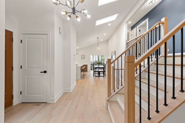 787 Bluejay Cir, Elk Grove Village, IL 60007 - entrance foyer featuring a chandelier, light wood-style flooring, stairway, recessed lighting, and high vaulted ceiling