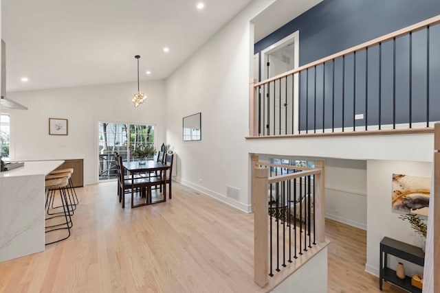 787 Bluejay Cir, Elk Grove Village, IL 60007 - dining space with light wood finished floors, recessed lighting, and a towering ceiling