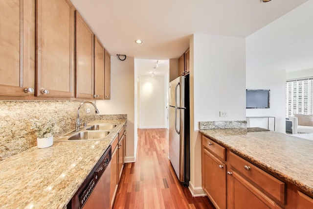 30 E Huron St Unit 2602, Chicago, IL 60611 - kitchen with appliances with stainless steel finishes, wood finished floors, recessed lighting, light stone countertops, and brown cabinetry