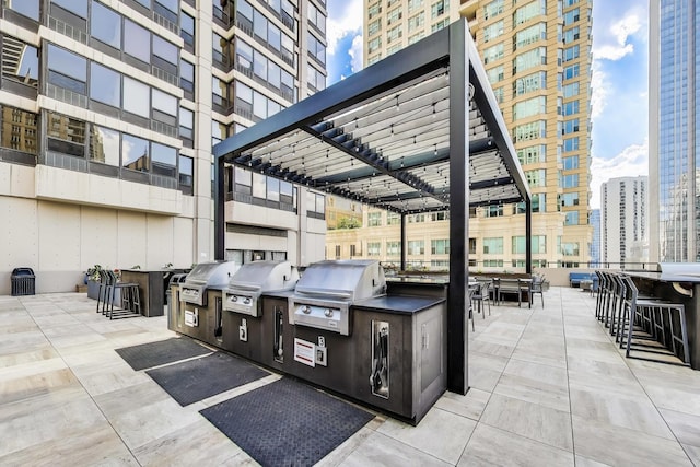 30 E Huron St Unit 2602, Chicago, IL 60611 - view of patio featuring an outdoor kitchen and a view of city