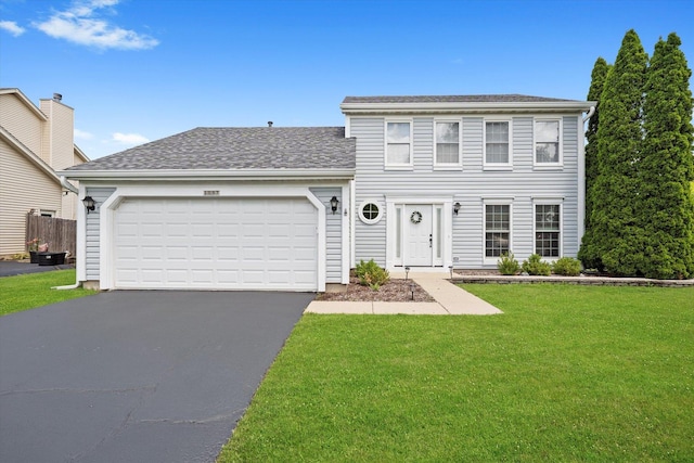 1097 Dovercliff Way, Crystal Lake, IL 60014 - colonial home with a front lawn, driveway, a garage, and roof with shingles