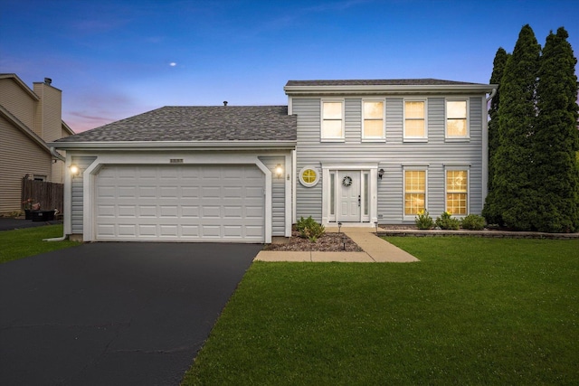 1097 Dovercliff Way, Crystal Lake, IL 60014 - traditional-style house with asphalt driveway, a yard, a garage, and roof with shingles