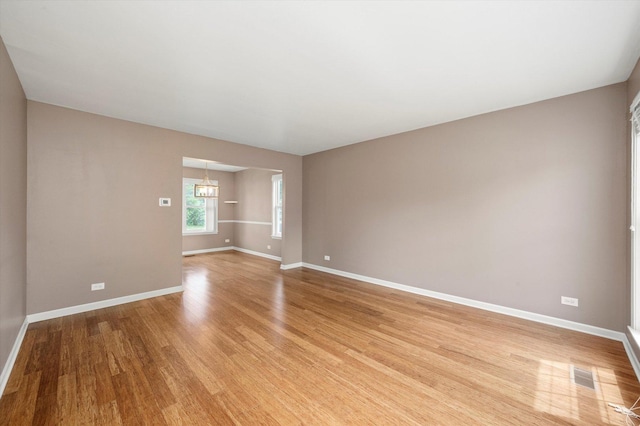 1097 Dovercliff Way, Crystal Lake, IL 60014 - empty room with light wood-type flooring and a chandelier