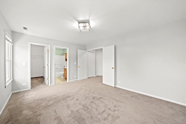 1097 Dovercliff Way, Crystal Lake, IL 60014 - unfurnished bedroom with a spacious closet, a closet, light carpet, and connected bathroom