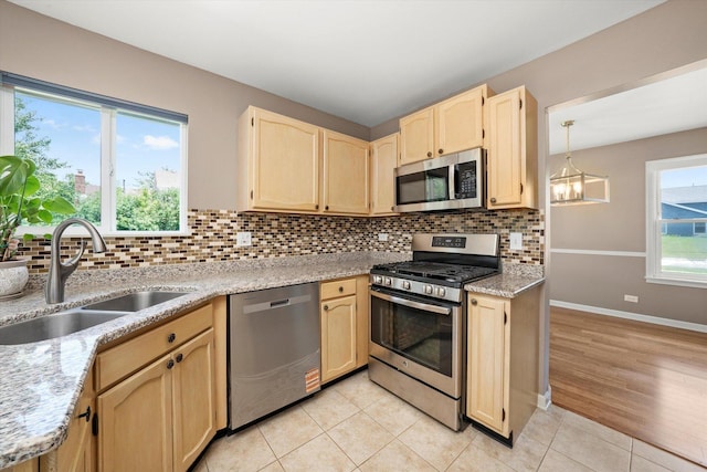 1097 Dovercliff Way, Crystal Lake, IL 60014 - kitchen with appliances with stainless steel finishes, light brown cabinets, tasteful backsplash, and light tile patterned floors