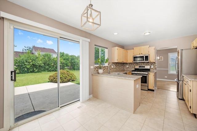 1097 Dovercliff Way, Crystal Lake, IL 60014 - kitchen featuring stainless steel appliances, light brown cabinetry, tasteful backsplash, a peninsula, and light tile patterned floors