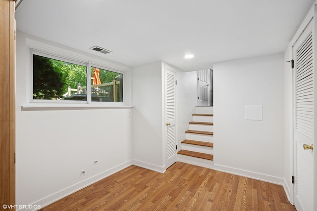 516 W Weathersfield Way, Schaumburg, IL 60193 - below grade area with wood finished floors, stairway, and recessed lighting