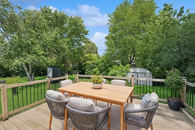 516 W Weathersfield Way, Schaumburg, IL 60193 - wooden terrace featuring a storage unit, outdoor dining area, and a lawn