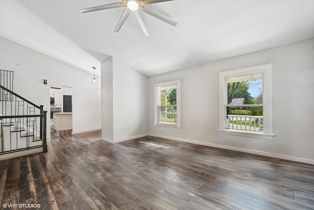 516 W Weathersfield Way, Schaumburg, IL 60193 - unfurnished living room with wood finished floors, lofted ceiling, ceiling fan, and stairway