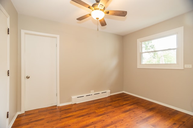 1103 Circle Ave, Forest Park, IL 60130 - unfurnished room featuring a baseboard radiator, wood finished floors, and a ceiling fan