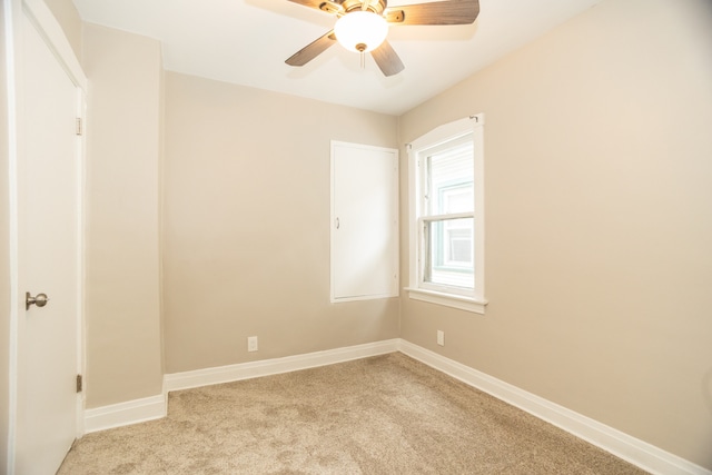 1103 Circle Ave, Forest Park, IL 60130 - spare room featuring light carpet and a ceiling fan