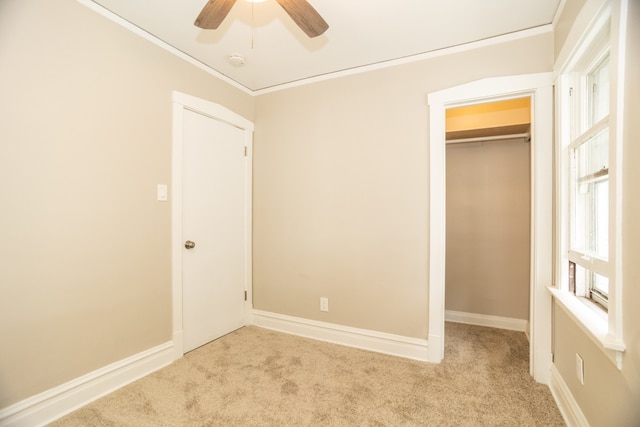 1103 Circle Ave, Forest Park, IL 60130 - unfurnished bedroom with carpet, ornamental molding, a spacious closet, and ceiling fan