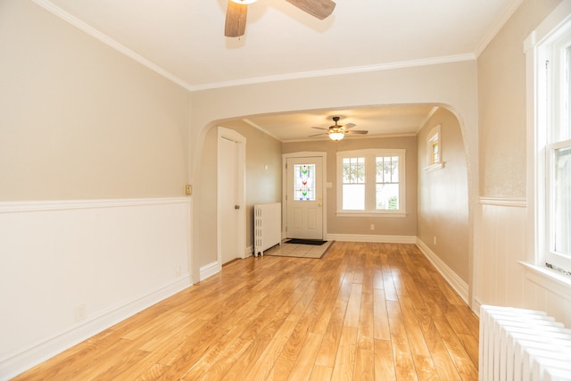 1103 Circle Ave, Forest Park, IL 60130 - foyer with radiator, arched walkways, ceiling fan, wainscoting, and crown molding