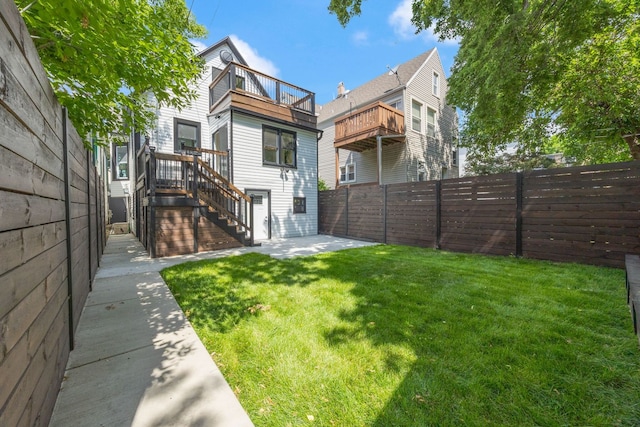 4143 N Drake Ave, Chicago, IL 60618 - rear view of house featuring a balcony, a fenced backyard, stairs, and a patio