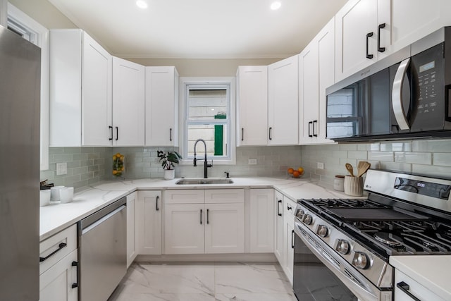 4143 N Drake Ave, Chicago, IL 60618 - kitchen with stainless steel appliances, light marble finish flooring, white cabinetry, recessed lighting, and light stone counters