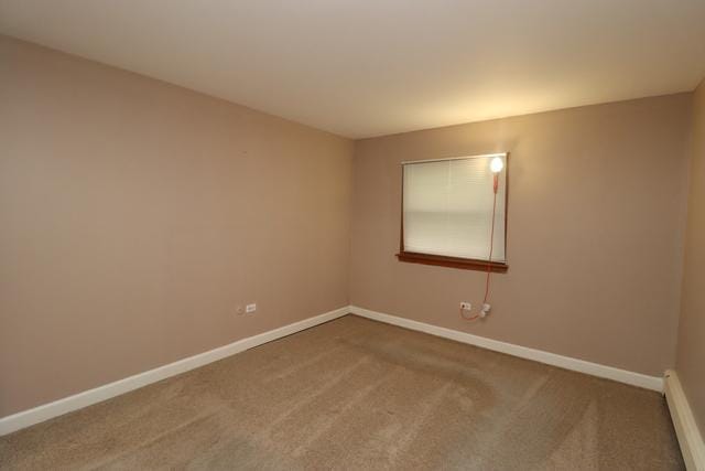 815 Grove Dr Unit 112, Buffalo Grove, IL 60089 - carpeted spare room with baseboards and a baseboard radiator
