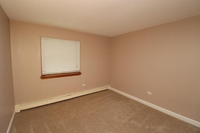 815 Grove Dr Unit 112, Buffalo Grove, IL 60089 - carpeted spare room with a baseboard radiator and baseboards