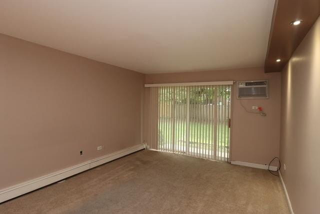 815 Grove Dr Unit 112, Buffalo Grove, IL 60089 - carpeted spare room with baseboard heating, a wall unit AC, and recessed lighting