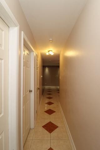 815 Grove Dr Unit 112, Buffalo Grove, IL 60089 - hallway with light tile patterned flooring
