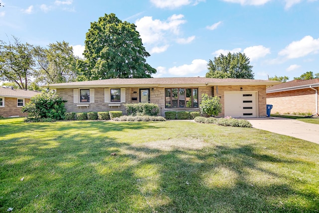 731 Bishop Ct, Bradley, IL 60915 - ranch-style home featuring a garage, concrete driveway, a front yard, and stone siding