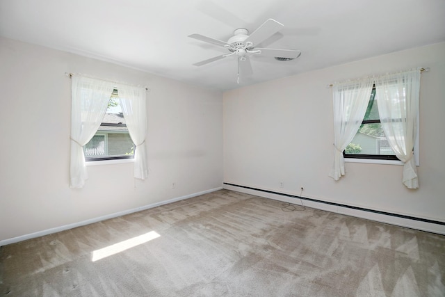 731 Bishop Ct, Bradley, IL 60915 - carpeted empty room with a baseboard heating unit and ceiling fan