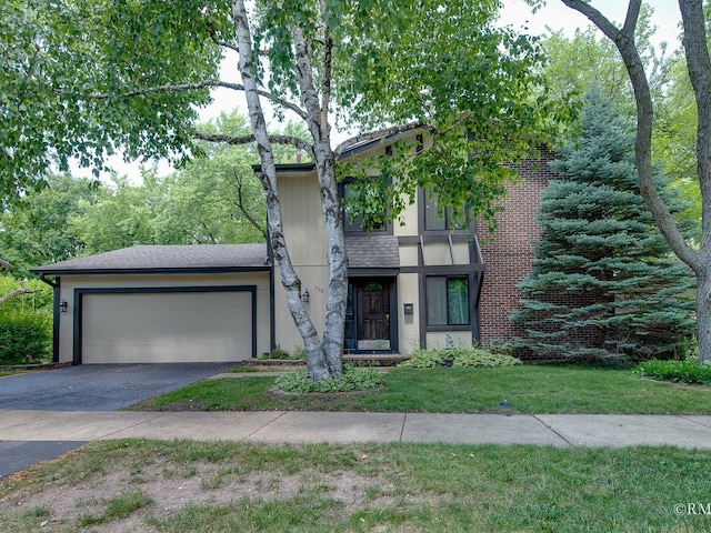 780 Chisholm Trl, Roselle, IL 60172 - view of front of house with asphalt driveway, an attached garage, and a front lawn