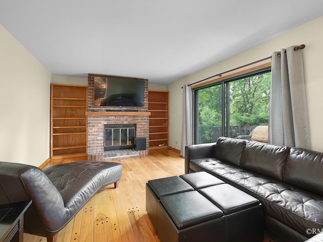 780 Chisholm Trl, Roselle, IL 60172 - living area featuring hardwood / wood-style flooring and a brick fireplace