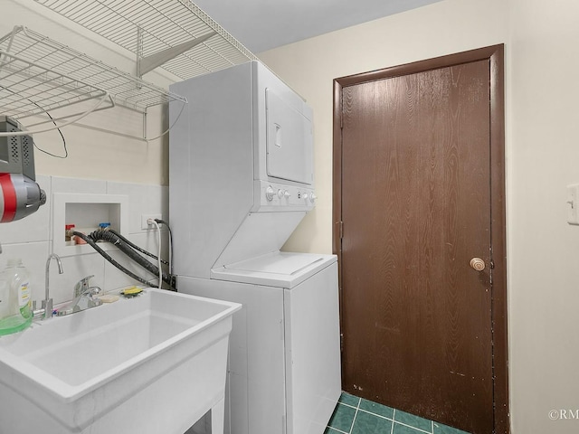 780 Chisholm Trl, Roselle, IL 60172 - laundry room featuring stacked washer / dryer and tile patterned floors