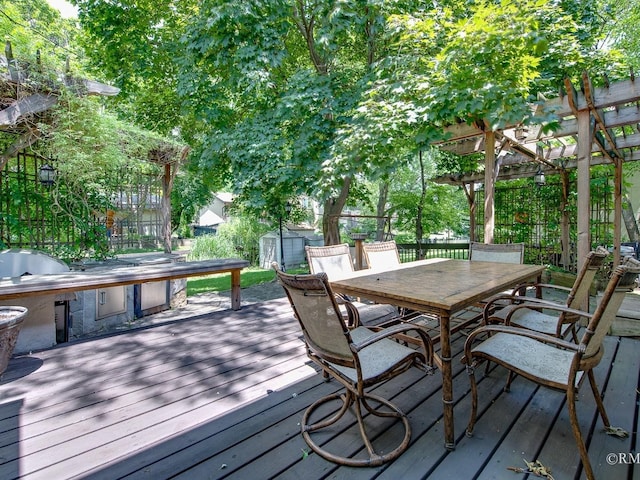 780 Chisholm Trl, Roselle, IL 60172 - wooden deck with outdoor dining space, area for grilling, a storage unit, and a pergola