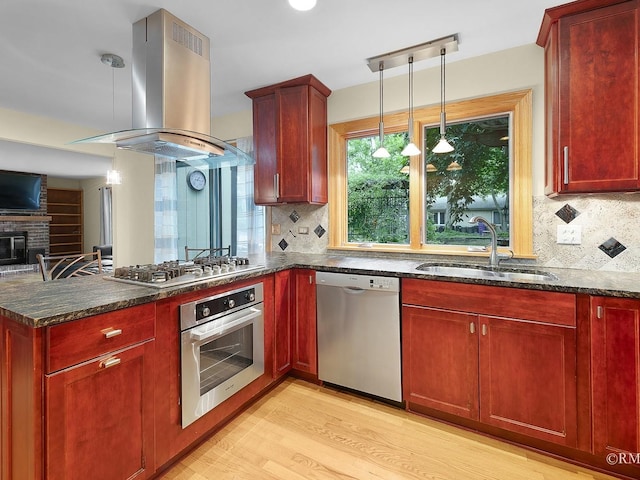780 Chisholm Trl, Roselle, IL 60172 - kitchen featuring appliances with stainless steel finishes, island exhaust hood, reddish brown cabinets, and tasteful backsplash