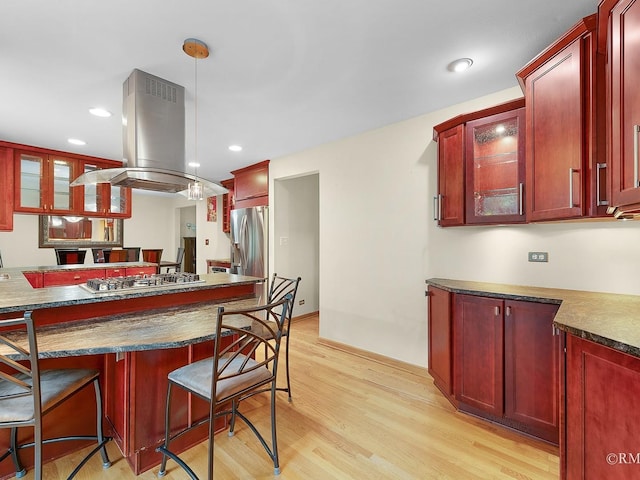 780 Chisholm Trl, Roselle, IL 60172 - kitchen with dark brown cabinets, island range hood, dark countertops, and recessed lighting