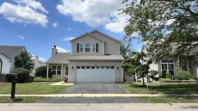 182 Cherrywood Ct, Romeoville, IL 60446 - traditional home featuring asphalt driveway, a garage, and a front lawn