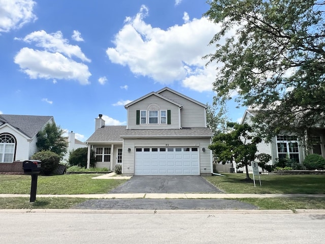 182 Cherrywood Ct, Romeoville, IL 60446 - traditional home with an attached garage, driveway, and a front yard