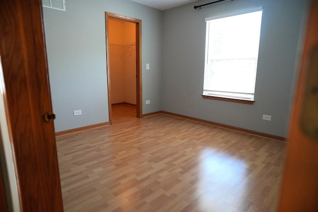 182 Cherrywood Ct, Romeoville, IL 60446 - spare room featuring light wood-style floors and baseboards