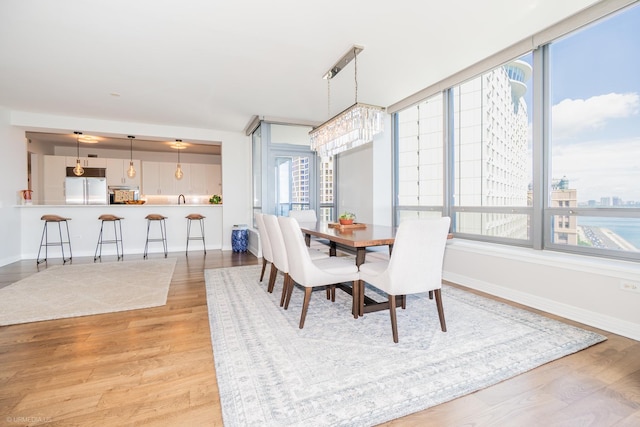600 N Lake Shore Dr Unit 1905, Chicago, IL 60611 - dining room featuring wood finished floors and a chandelier