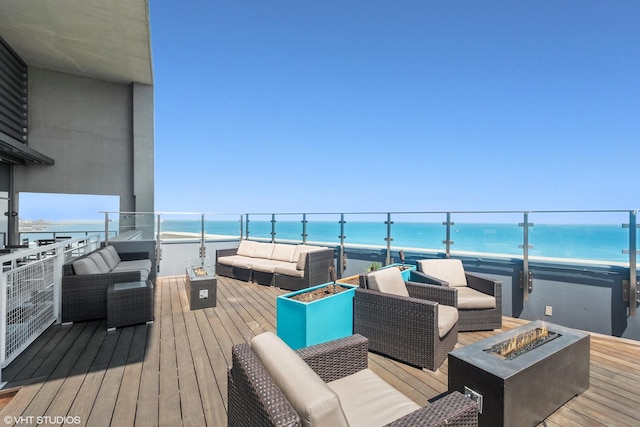 600 N Lake Shore Dr Unit 1905, Chicago, IL 60611 - wooden deck featuring a water view and an outdoor living space with a fire pit