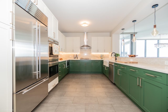 600 N Lake Shore Dr Unit 1905, Chicago, IL 60611 - kitchen featuring stainless steel appliances, green cabinetry, wall chimney range hood, and white cabinets