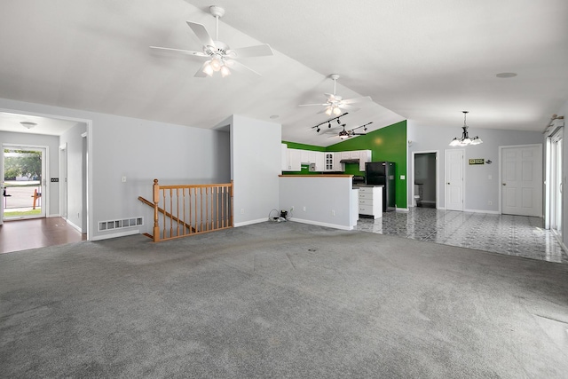 1642 Waterberry Ct, Bourbonnais, IL 60914 - unfurnished living room with lofted ceiling, carpet floors, a ceiling fan, and a chandelier