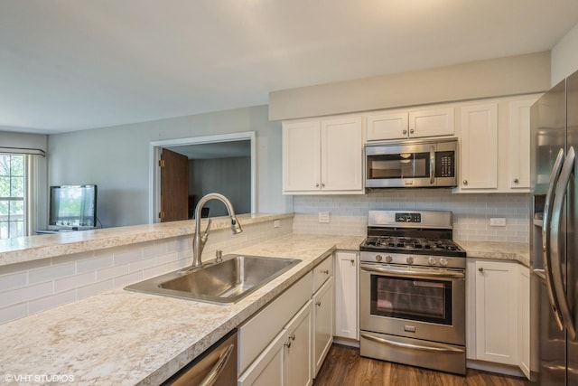 260 W Lynn Dr Unit 7-5B, Palatine, IL 60067 - kitchen featuring stainless steel appliances, light countertops, decorative backsplash, and white cabinets